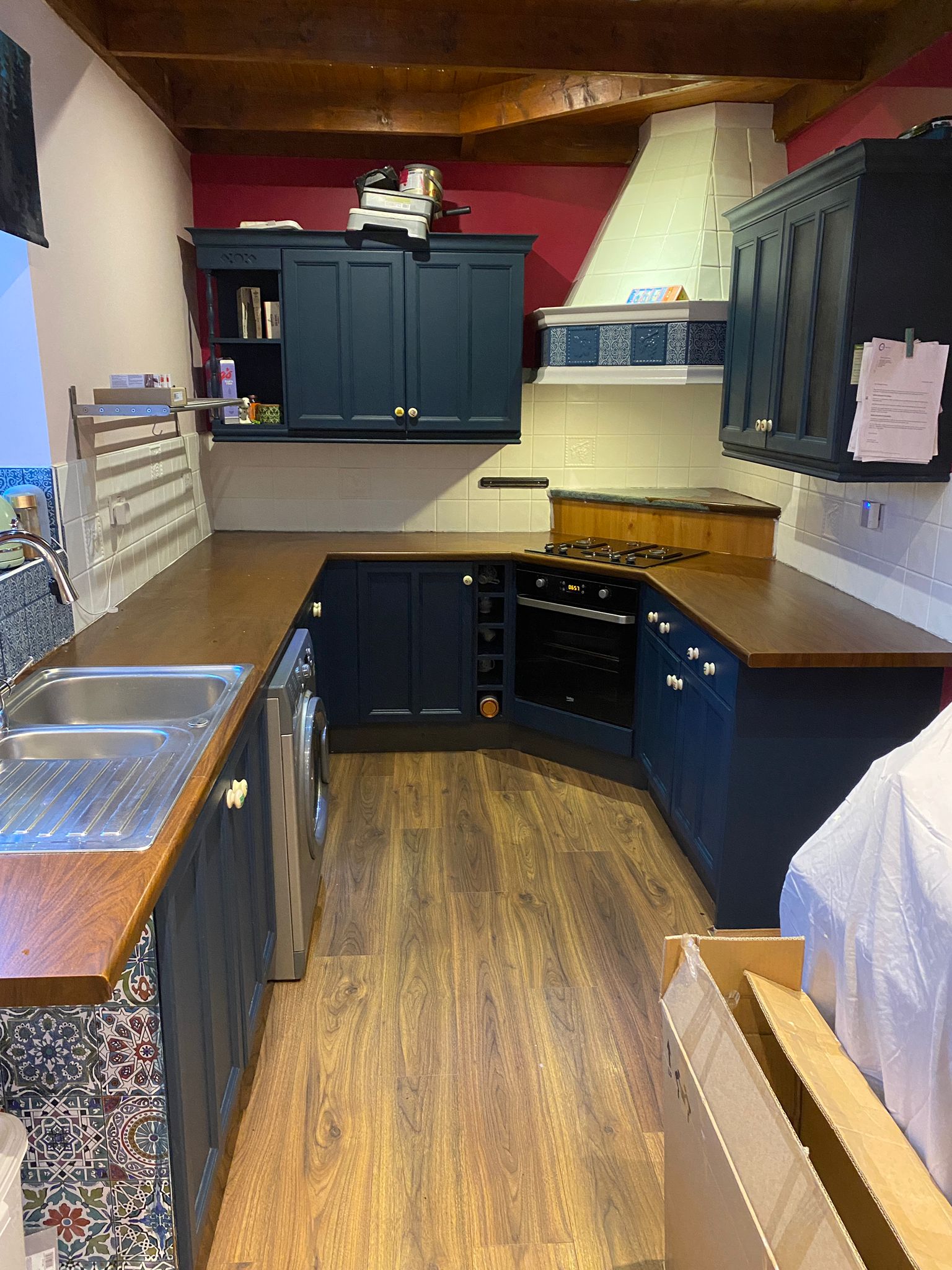 Navy shaker kitchen with wooden worktops